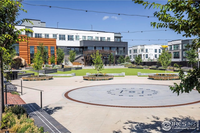 view of property's community with a lawn