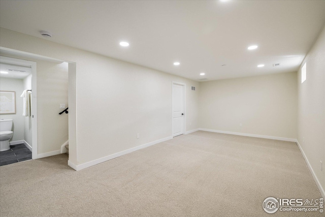 below grade area with baseboards, carpet, visible vents, and recessed lighting