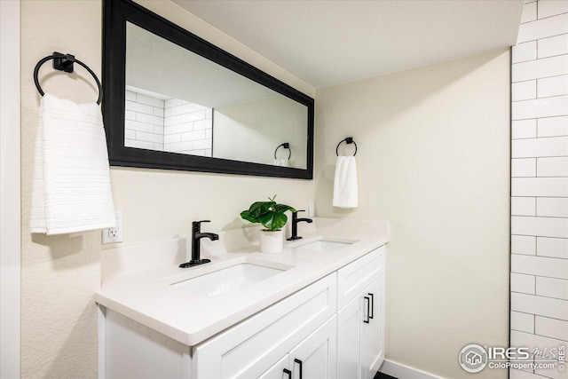 bathroom with double vanity and a sink