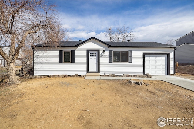 ranch-style house featuring a garage, crawl space, and driveway