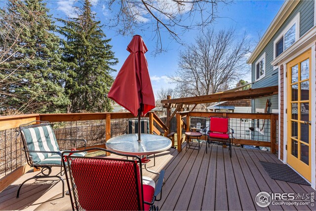 deck with a yard, stairway, a pergola, and fence