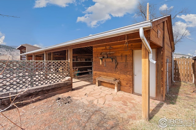 view of patio / terrace with an outbuilding and an exterior structure