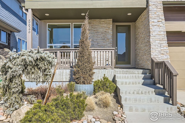 5626 Four Leaf Dr, Longmont, CO 80503 - entrance to property with stone siding and a porch