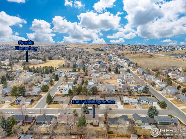 birds eye view of property with a residential view