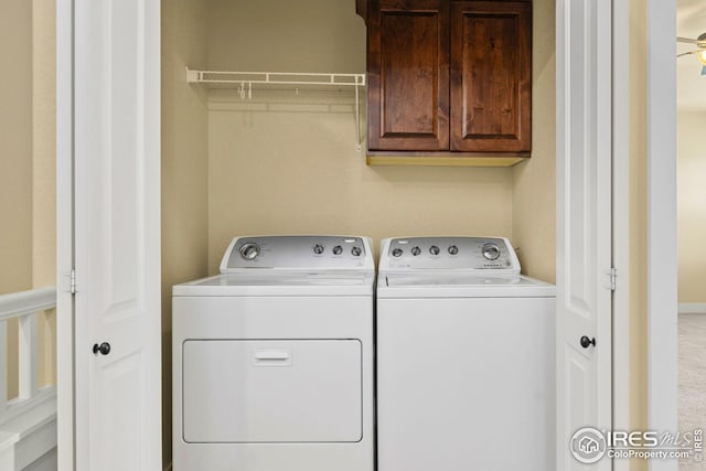 5850 Dripping Rock Ln, Fort Collins, CO 80528 - laundry room with cabinet space and washing machine and clothes dryer