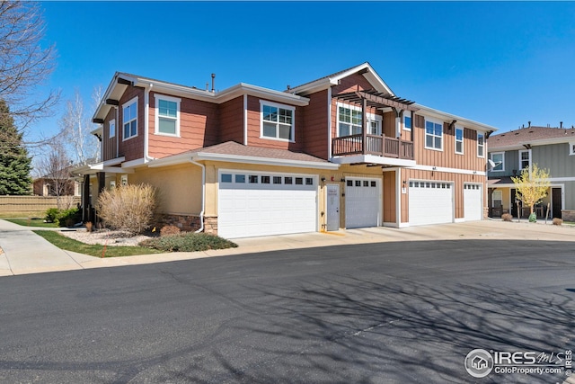 5850 Dripping Rock Ln, Fort Collins, CO 80528 - multi unit property featuring a garage, stone siding, and a pergola
