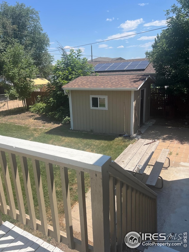 view of yard with a storage shed, an outdoor structure, and a fenced backyard