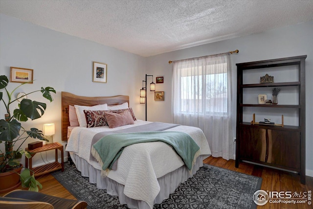 1105 Bacchus Dr Unit 8, Lafayette, CO 80026 - bedroom with a textured ceiling and wood finished floors
