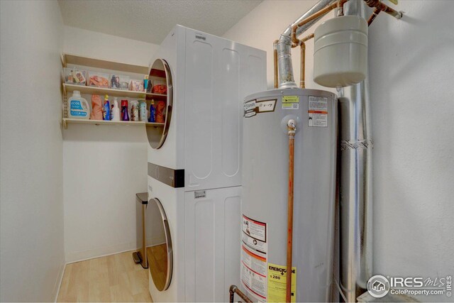 1105 Bacchus Dr Unit 8, Lafayette, CO 80026 - utility room with gas water heater and stacked washer and clothes dryer