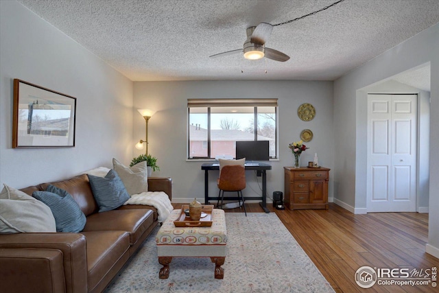 1105 Bacchus Dr Unit 8, Lafayette, CO 80026 - living room with ceiling fan, a textured ceiling, baseboards, and wood finished floors