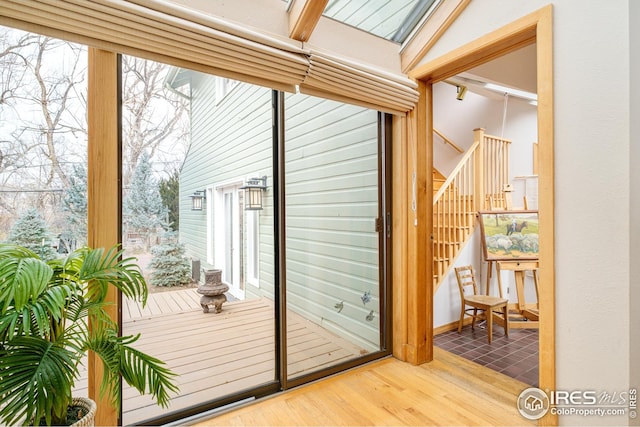 entryway featuring stairway and wood finished floors