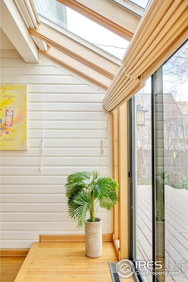 room details with visible vents and wooden walls
