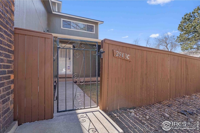 view of gate featuring fence