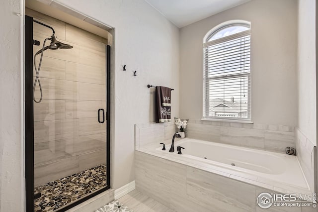 5541 Tullamore Ct, Timnath, CO 80547 - full bath featuring a shower stall and a jetted tub