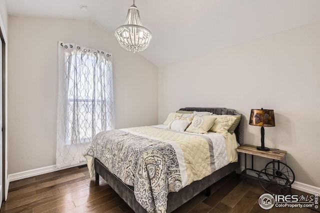 5541 Tullamore Ct, Timnath, CO 80547 - bedroom featuring lofted ceiling, a chandelier, multiple windows, hardwood / wood-style flooring, and baseboards