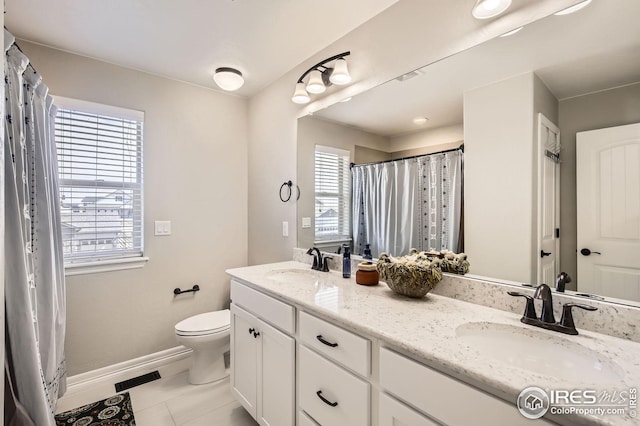 5541 Tullamore Ct, Timnath, CO 80547 - bathroom featuring toilet, baseboards, tile patterned flooring, and double vanity
