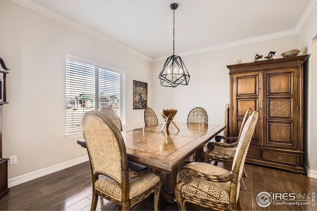 5541 Tullamore Ct, Timnath, CO 80547 - dining area with dark wood-style floors, ornamental molding, baseboards, and a chandelier