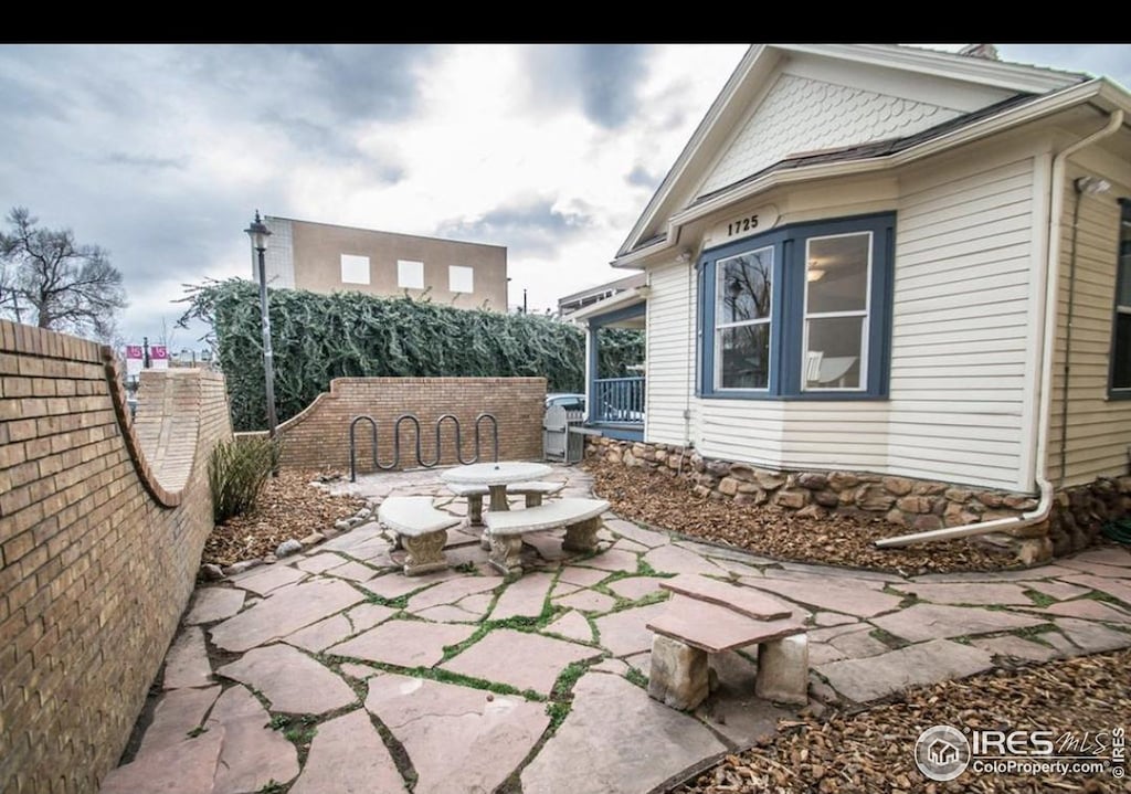 view of patio with a fenced backyard and outdoor dining space