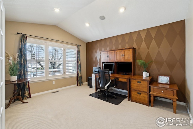 office space featuring baseboards, carpet, vaulted ceiling, and wallpapered walls