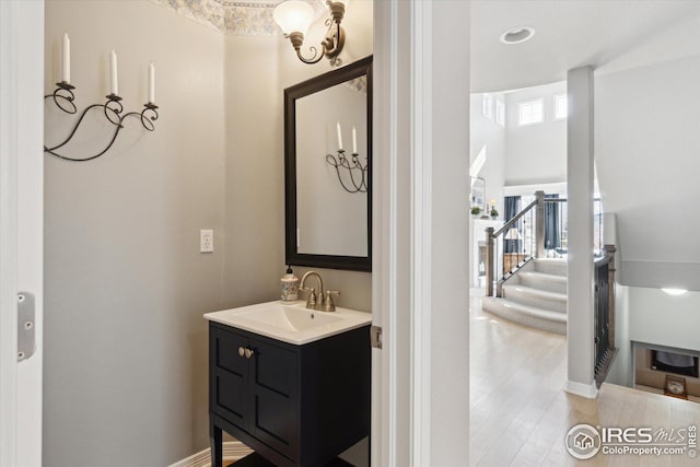 bathroom with vanity and wood finished floors