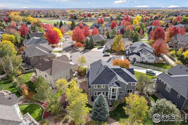 birds eye view of property with a residential view