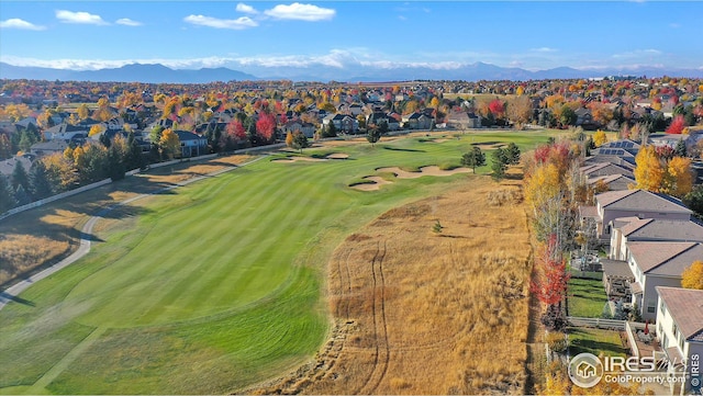 birds eye view of property featuring a residential view, a mountain view, and view of golf course