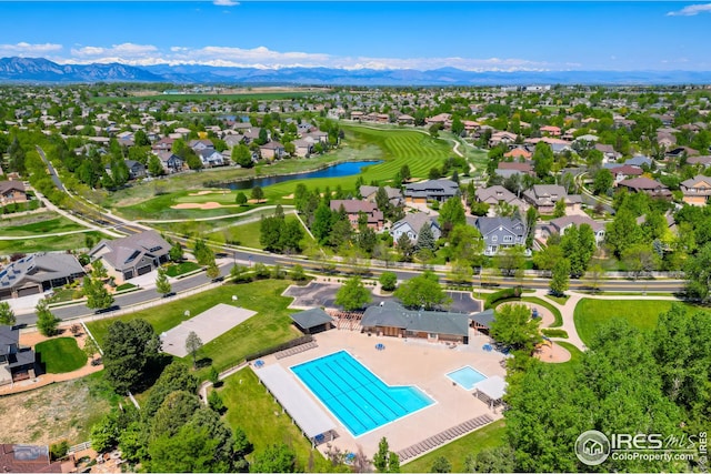 bird's eye view with a residential view and a water and mountain view