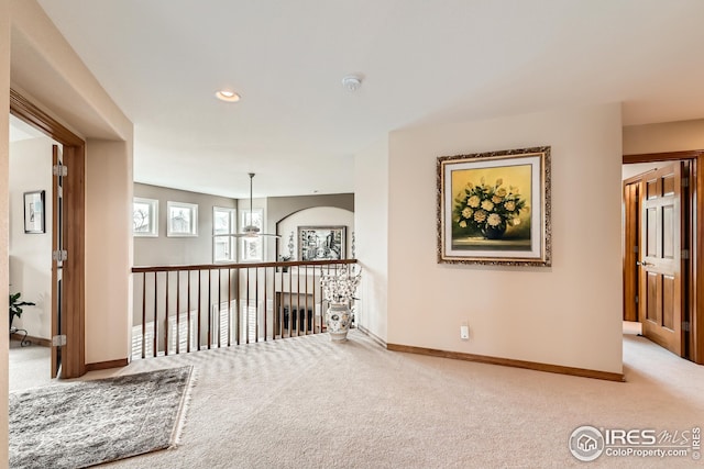 corridor featuring baseboards, carpet floors, and recessed lighting