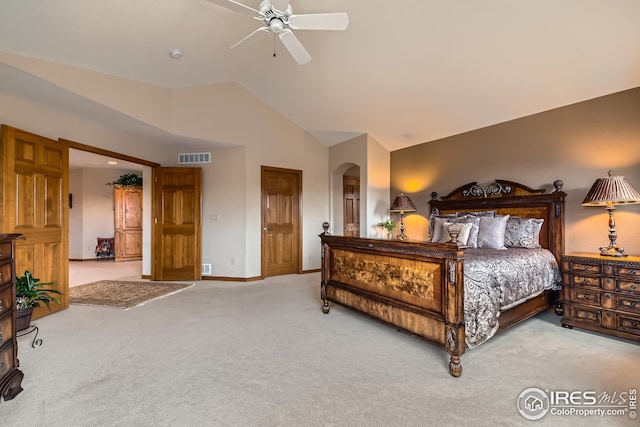 carpeted bedroom featuring vaulted ceiling, visible vents, arched walkways, baseboards, and ceiling fan