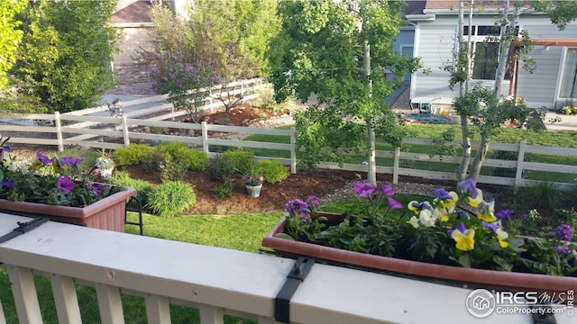 view of property's community featuring fence