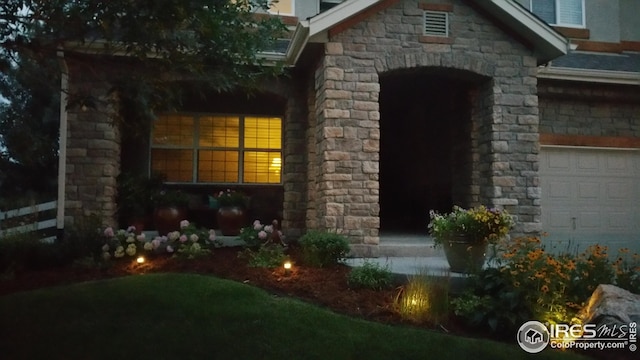entrance to property with stone siding