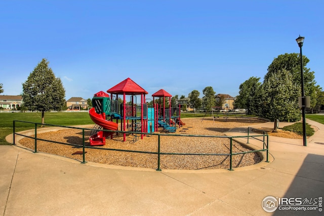 community play area featuring a yard