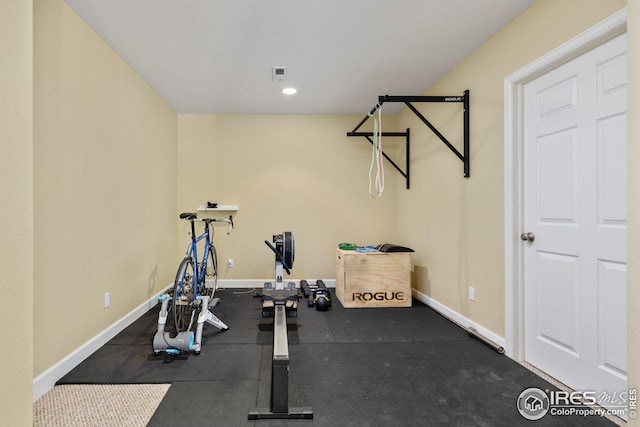 exercise area with visible vents and baseboards