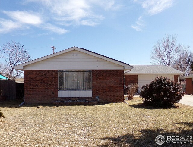 view of side of property with brick siding