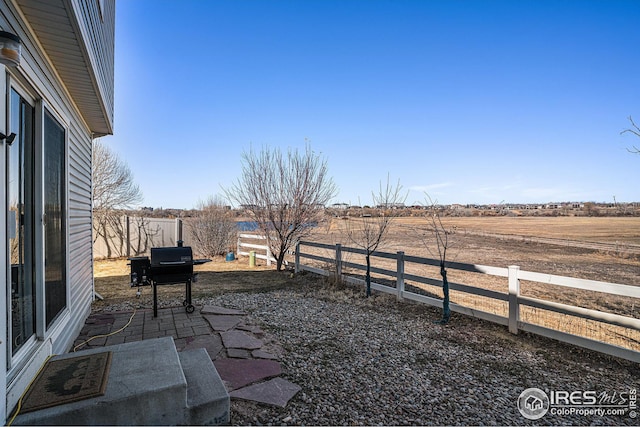 view of yard with a fenced backyard and a patio area