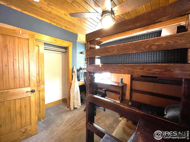 bedroom with carpet flooring, wooden ceiling, and ceiling fan