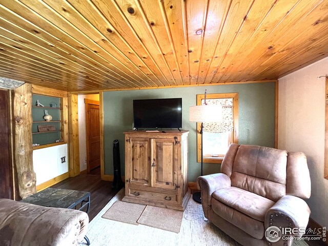living room with wooden ceiling, wood finished floors, and baseboards