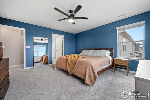 bedroom featuring a ceiling fan, carpet flooring, baseboards, and visible vents