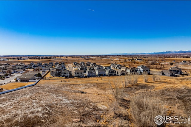 aerial view featuring a mountain view and a residential view