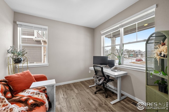 office space featuring wood finished floors and baseboards