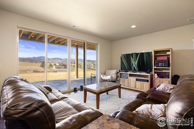 living area with recessed lighting and visible vents