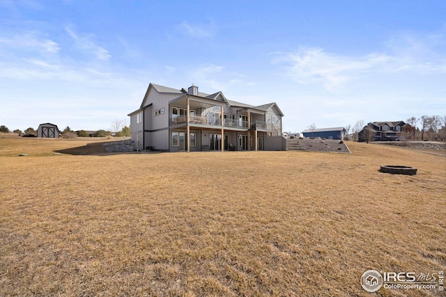 view of front of home with a front lawn and a wooden deck