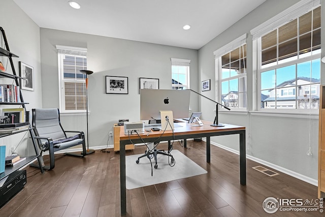 office featuring recessed lighting, visible vents, baseboards, and dark wood-type flooring