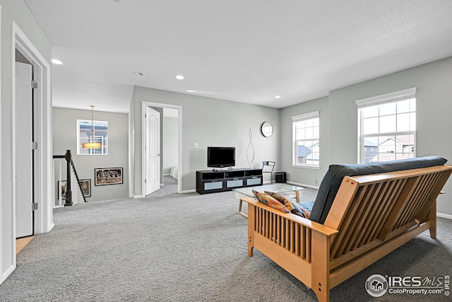 living area featuring carpet flooring, recessed lighting, and baseboards