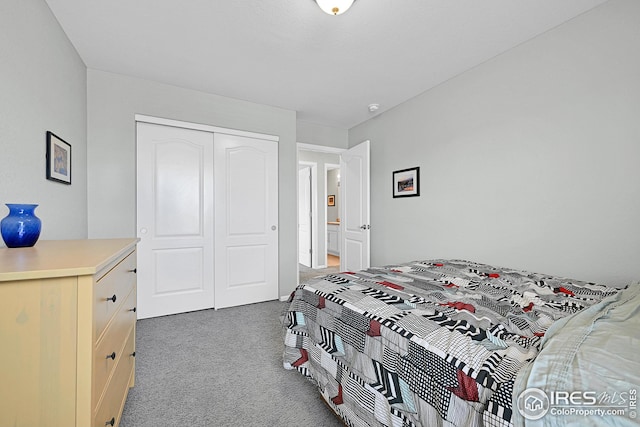 carpeted bedroom with a closet