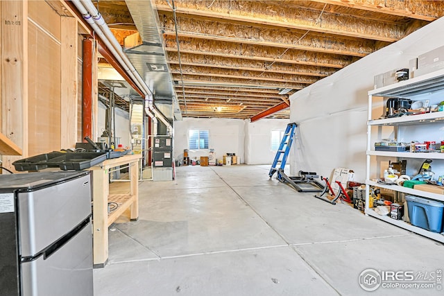 basement with freestanding refrigerator