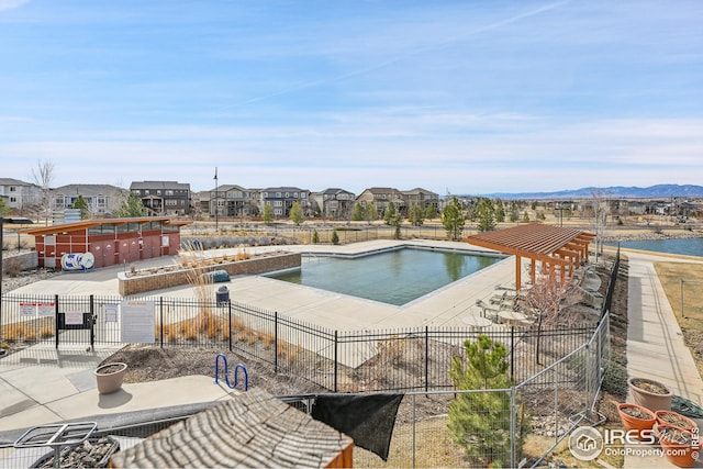 view of swimming pool with fence