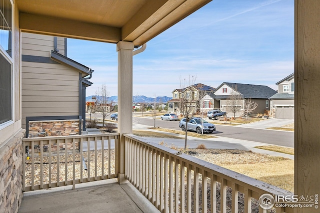 balcony featuring a residential view and covered porch