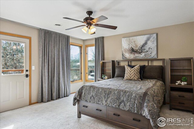 bedroom featuring visible vents, carpet, and a ceiling fan