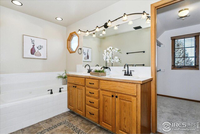 full bath with double vanity, a bath, and a sink